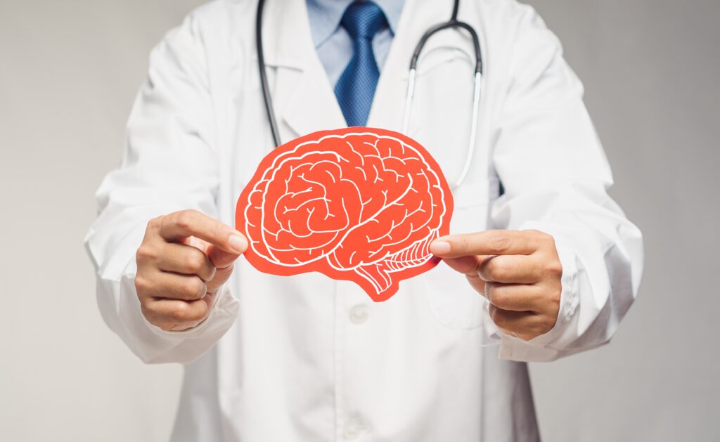 TIA misdiagnosis lawsuit NM concept with doctor reviewing brain scan.